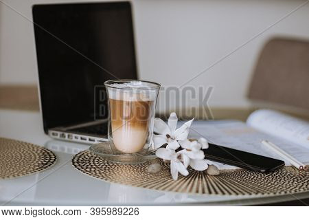 Notepad, Laptop And Coffee Cup On Wood Table. View From Above