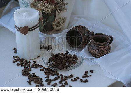 A Cup Of Cappuccino With Coffee Bean As Background