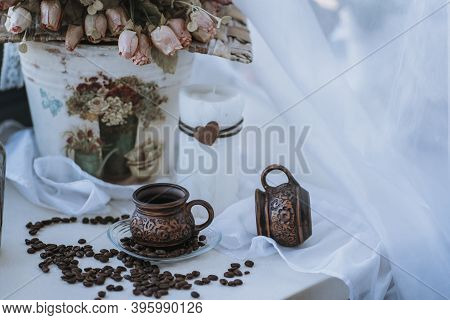 A Cup Of Cappuccino With Coffee Bean As Background