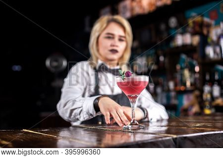 Expert Woman Mixologist Demonstrates The Process Of Making A Cocktail Behind Bar