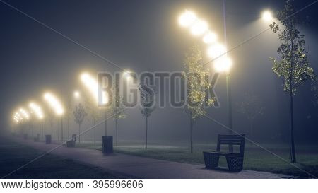 Lanterns On The Street Of The Night City In The Fog.