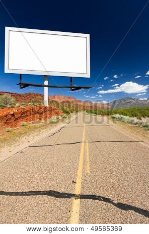 Blank Billboard Sign On Empty Desert Highway