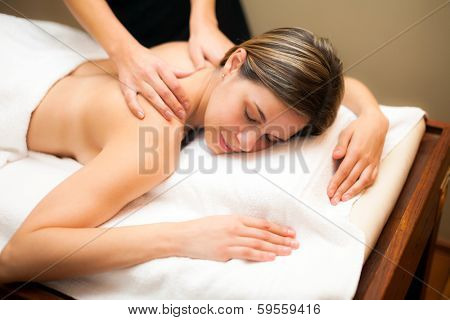 Young woman having a massage in a spa