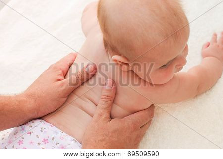 masseur doing massage little baby