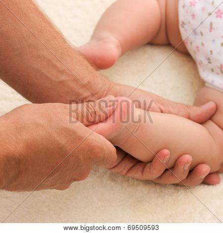 masseur doing massage little baby