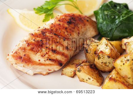 Grilled chicken breast with roasted potato and chard