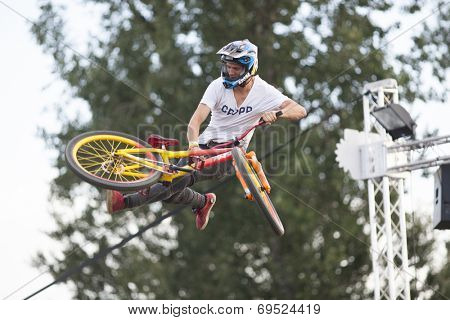 BONTIDA - JUNE 21: Unidentified BMX rider making a bike jump during the BMX Competition, at Electric Castle Festival on June 21, 2014 in the Banffy castle in Bontida, Romania