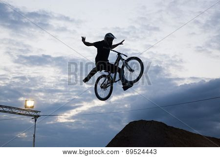 BONTIDA - JUNE 21: Unidentified BMX rider making a bike jump during the BMX Competition, at Electric Castle Festival on June 21, 2014 in the Banffy castle in Bontida, Romania
