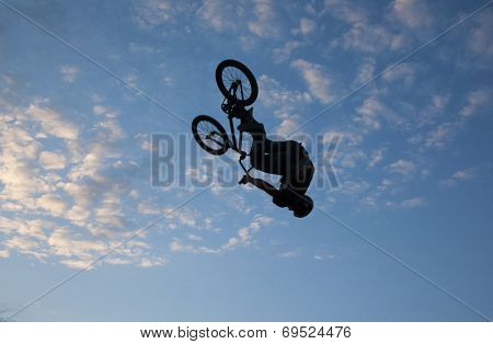 BONTIDA - JUNE 21: Unidentified BMX rider making a bike jump during the BMX Competition, at Electric Castle Festival on June 21, 2014 in the Banffy castle in Bontida, Romania