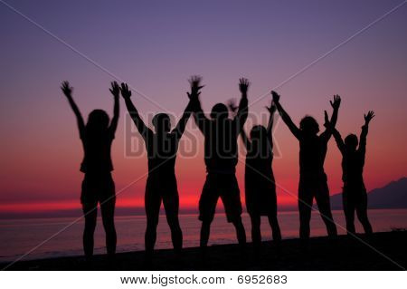 People silhouettes in sunset