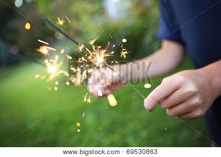 Child holding sparklers