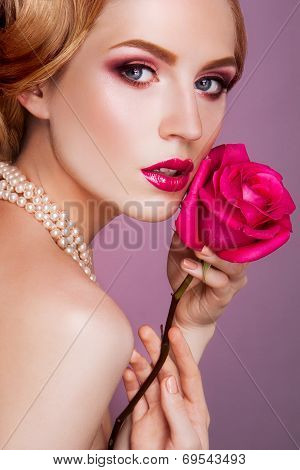 Lady with pink rose.