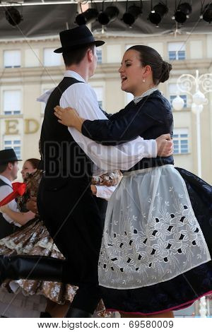 ZAGREB, CROATIA - JULY 19: Members of folk groups Nograd  from Salgotarjan, Hungary during the 48th International Folklore Festival in center of Zagreb, Croatia on July 19, 2014