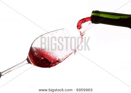 Pouring Wine Into A Glass Isolated