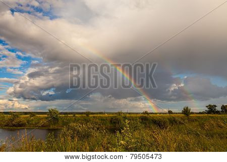 Colorful Ranibow Over The Falls And Water