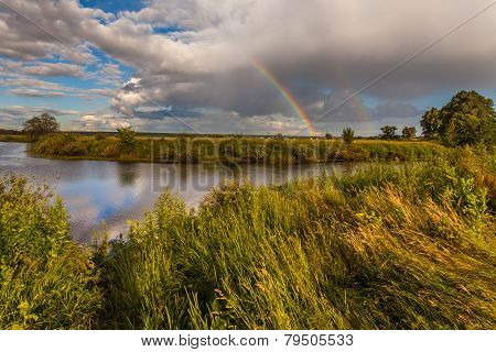 Colorful Ranibow Over The Falls And Water
