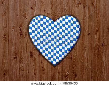 Wooden background with blue and white heart