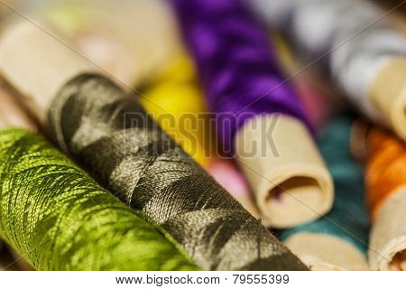 Colorful Sewing Thread Pattern. Colorful Miniature Bobbins Of Thread For Sewing