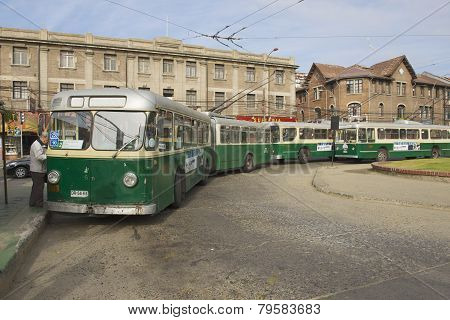 Man enters old trolleybus in Valparaiso, Chile