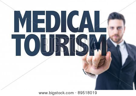 Business man pointing the text: Medical Tourism