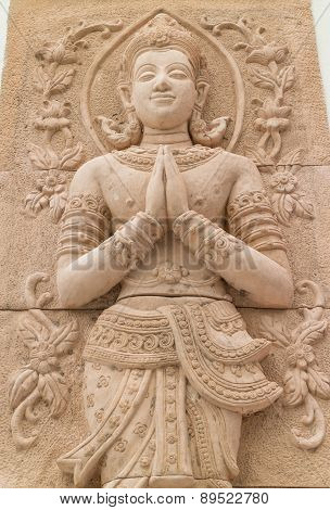 stone carving for greeting and smile deva statue