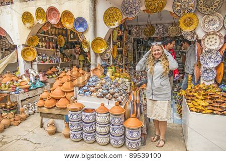 SAFI,  MOROCCO, APRIL 6, 2015: Tourists visit the pottery souk in Safi, capital of ceramics craft