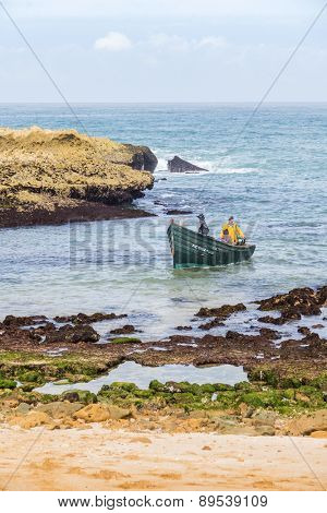 OUALIDIA, MOROCCO, APRIL 6, 2015: Fishermen come back from sea in fishing boat