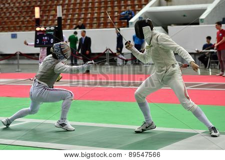 ST. PETERSBURG, RUSSIA - MAY 1, 2015: Marcus Mepstead of Great Britain vs Roland Schlosser of Austria in International fencing tournament St. Petersburg Foil. The tournament is the stage of World Cup