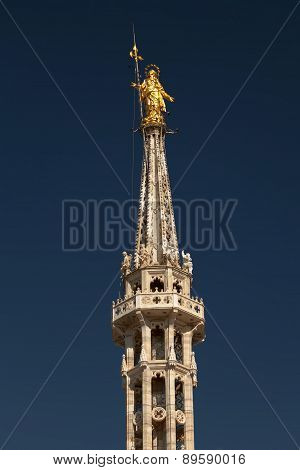 Statue Of The Madonna On Top Of The Milan Cathedral