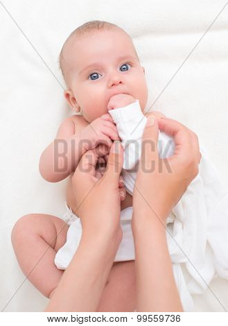 Cute Little Baby  Getting Dressed By Mother.
