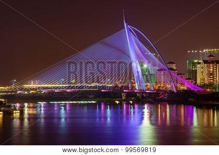 Beautiful Modern Bridge With Reflection At Night In Purple Colour