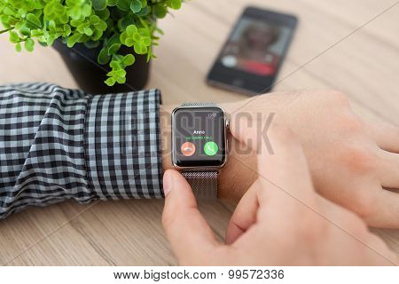 Man Hand With Apple Watch And Phone Call On Screen