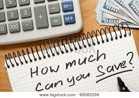 Notepad with how much can you save. Home budget concept.
