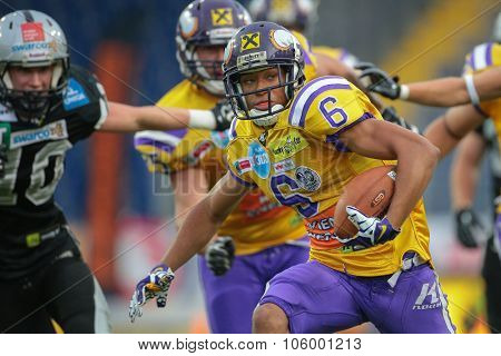 ST. POELTEN, AUSTRIA - JULY 26, 2014: WR Laurinho Walch (#6 Vikings) runs with the ball during Austrian Bowl XXX.