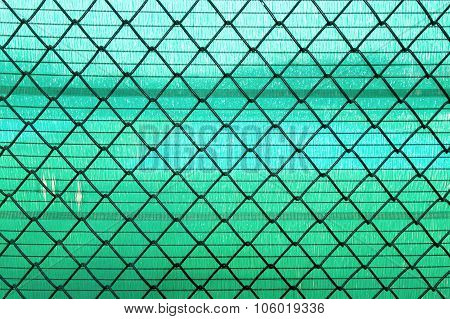 Steel Wire mesh on green slan background