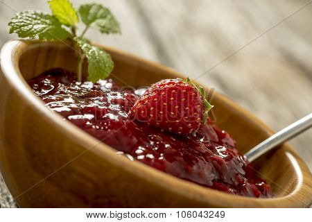 Closeup Of Delicious Home Made Strawberry Jam Served In An Elegant Wooden Bowl