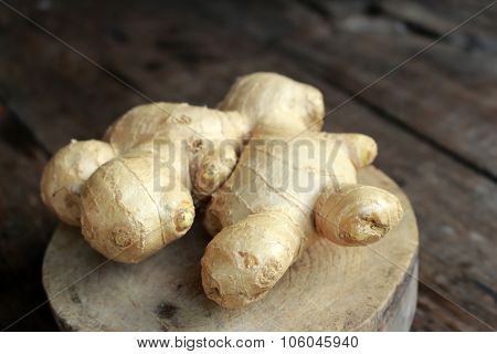 Fresh Ginger Root On Wooden Cut Background