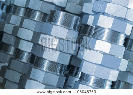Metal threaded connection parts closeup, technical blue