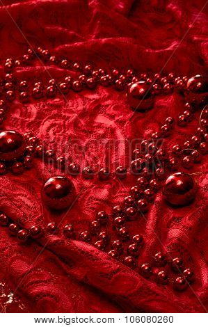 Christmas Garland Made From Small Red Beads.on A Red Background. New Year Toy.
