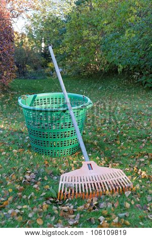 Rake, Leafs And Green Basket