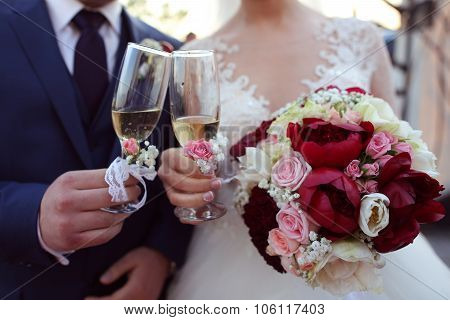 Bridal Couple Toasting Glasses Of Champagne