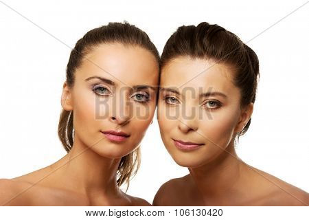 Two attractive sisters with make up.