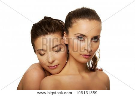 Two attractive sisters with make up.