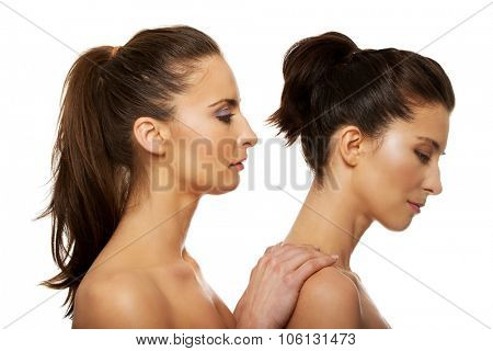Beauty woman with make up standing behind her friend.