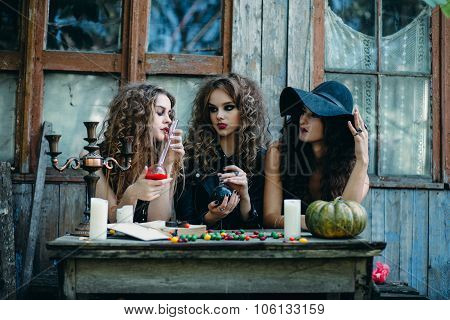 three witches at the table