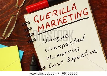 Notepad with guerilla marketing concept.