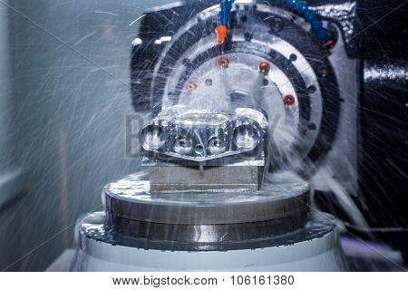 Metalworking CNC milling machine. Cutting metal modern processing technology. Small depth of field. Warning - authentic shooting in challenging conditions. A little bit grain and maybe blurred.