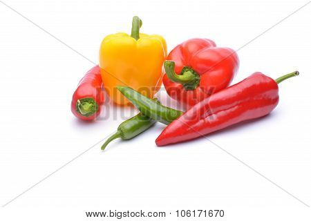 Colored Peppers On White Background