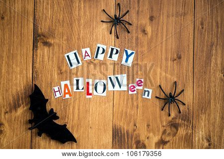 Happy Halloween Letters Cut Out From The Magazines, Bats And Black Spiders