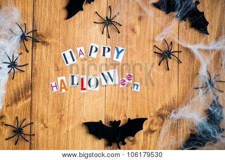Happy Halloween Letters Cut Out From The Magazines, Bats, Web And Black Spiders